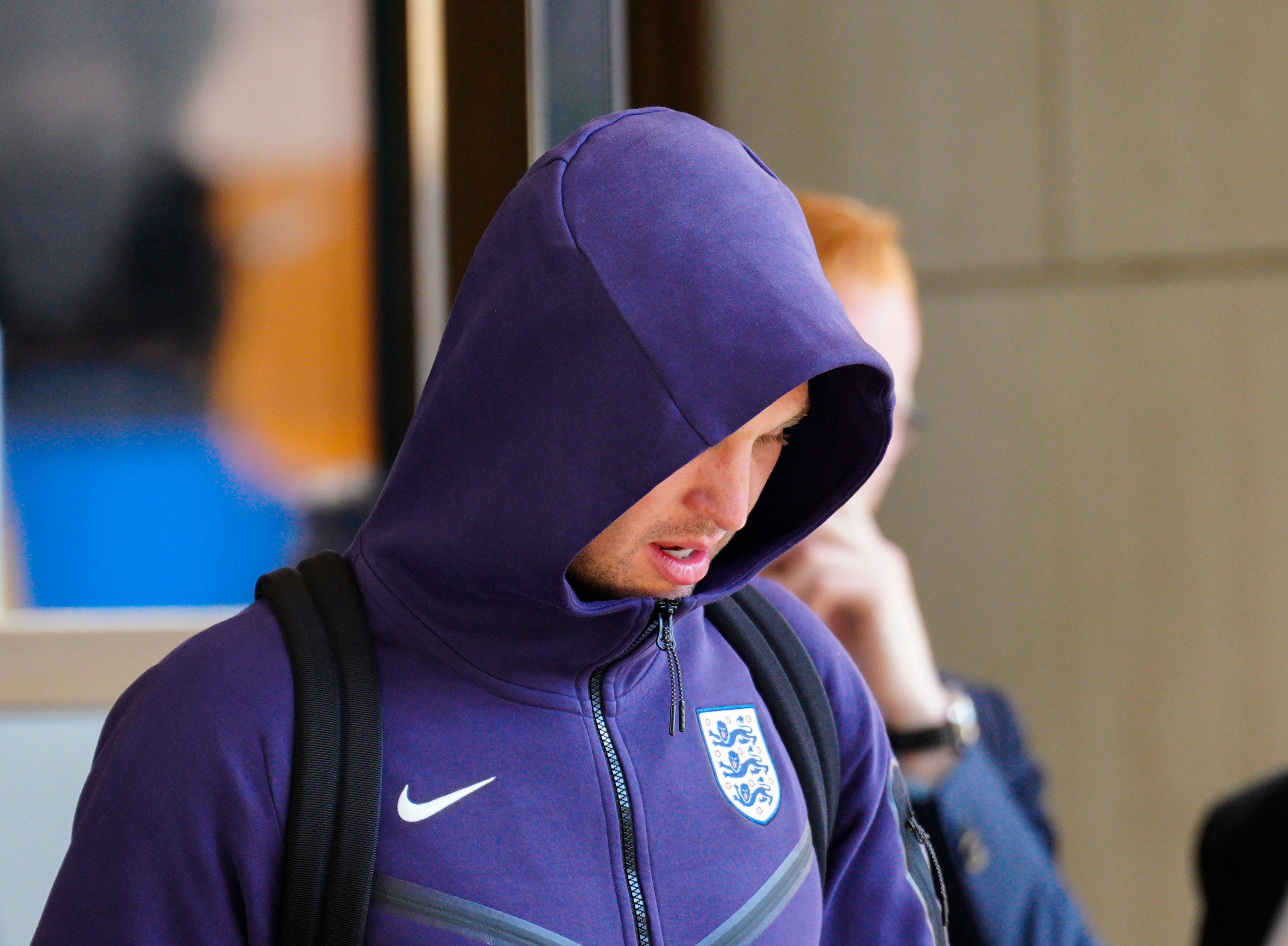 A gutted John Stones kept his hood up as he headed to the bus