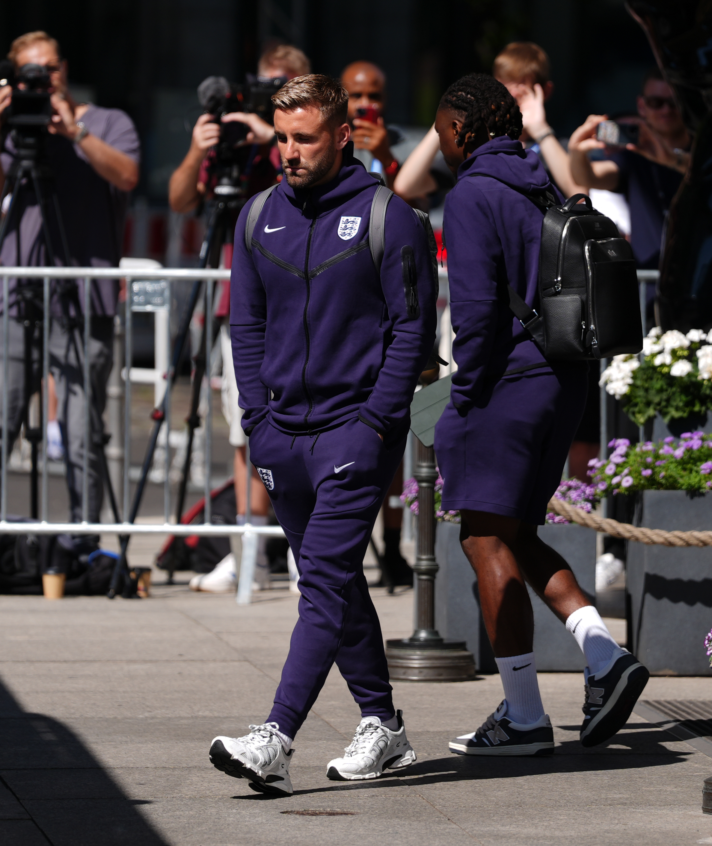 Luke Shaw looked disappointed as he walked onto the bus