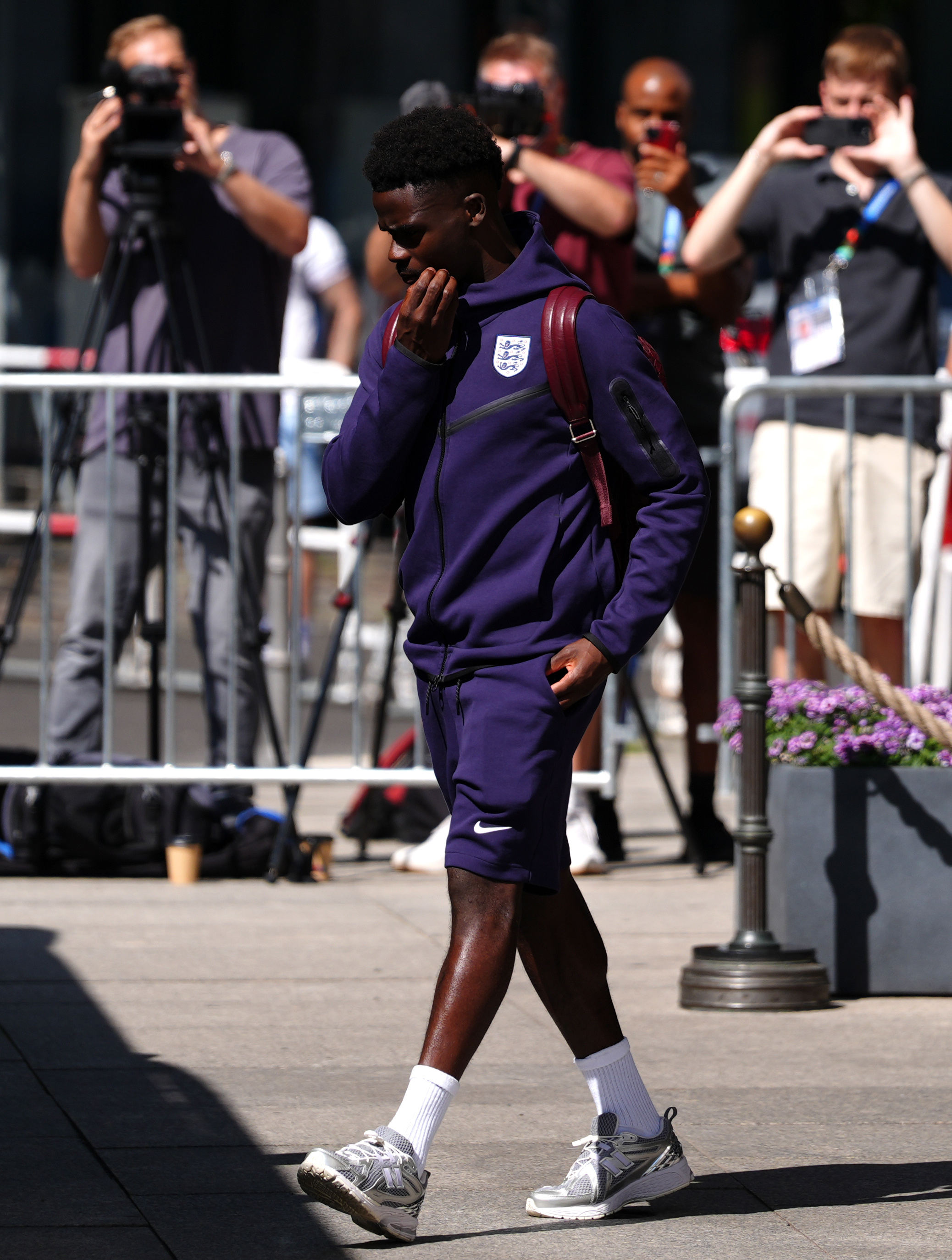 Bukayo Saka looked down before boarding England's team bus